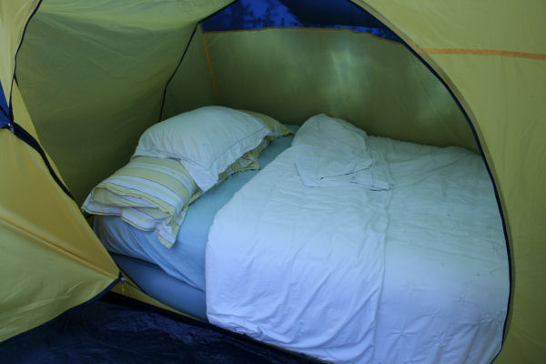 Mimosa Mansion - €25 per person per nightTwo roomed 4-6 person tent with central head height seating space. Two canopy porch openings. curtained windows, storage pockets. Sprung or luxury inflatable mattresses, bedding and towels included.